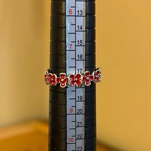 Red enamel painted flower all around ring in silver tone band size 8